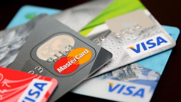 Нацбанк предлагает автоматически списывать с банковских карт оплату за коммуналку
