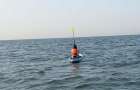 Девушку на доске унесло в море, догнали в районе судоходного канала